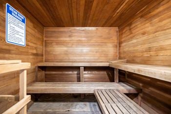 An empty sauna with wooden benches